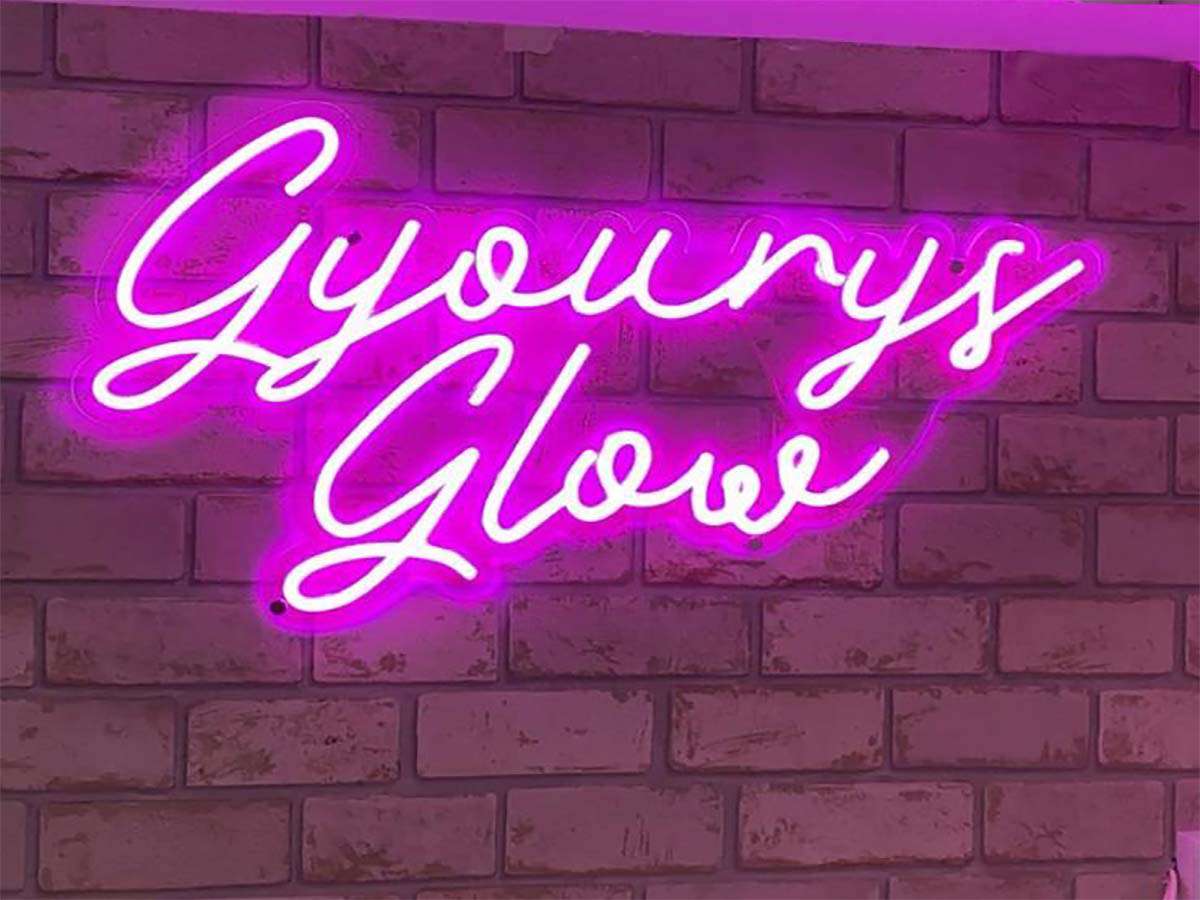 Gyourys' Salon glow sign displaying in the beauty treatments area of the salon in Takeley Essex.